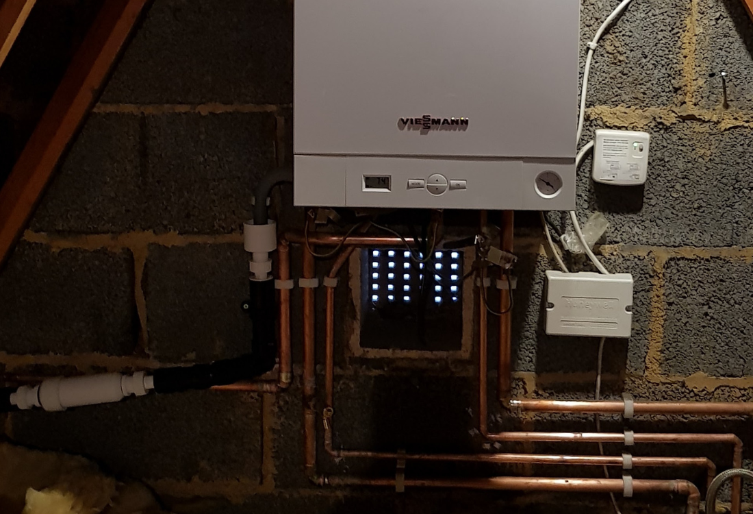 Viessman combi boiler in loft installed with pipe system.